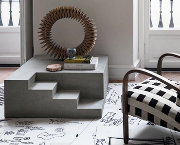 Tavolino di design monolitico e scultoreo in laccato materico cemento Mezzanino di Mogg