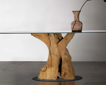 Tavolo Sequoia con basamento in radice di teak, top in vetro trasparente e base in metallo di Nature Design